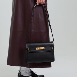 Handmade leather shoulder bag in brown with a relaxed shape for everyday use