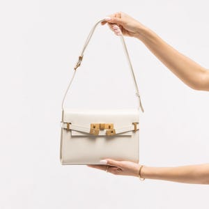 Handmade leather shoulder bag in brown with a relaxed shape for everyday use