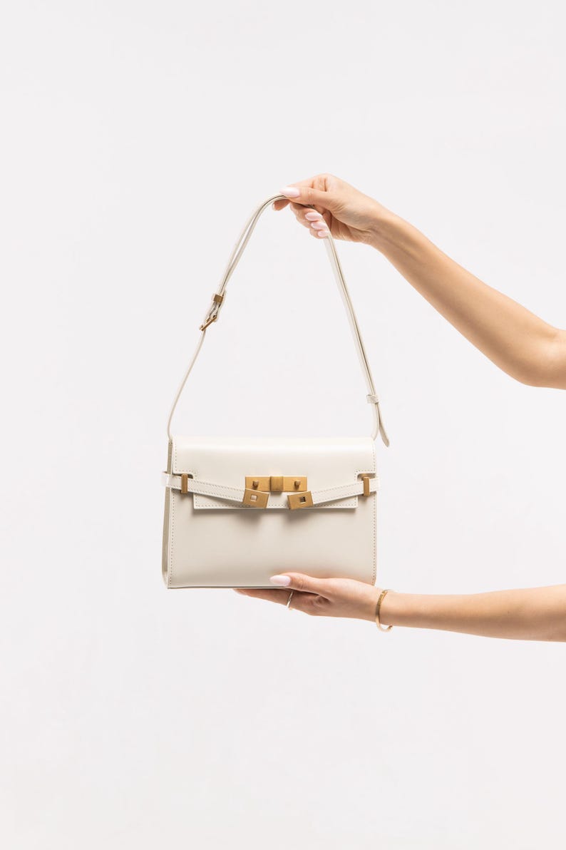 Handmade leather shoulder bag in brown with a relaxed shape for everyday use