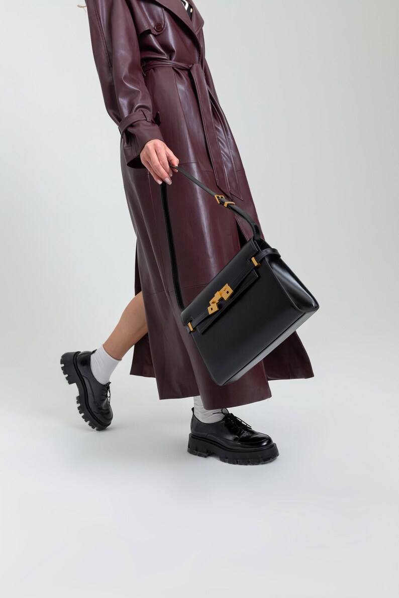 Handmade leather shoulder bag in brown with a relaxed shape for everyday use
