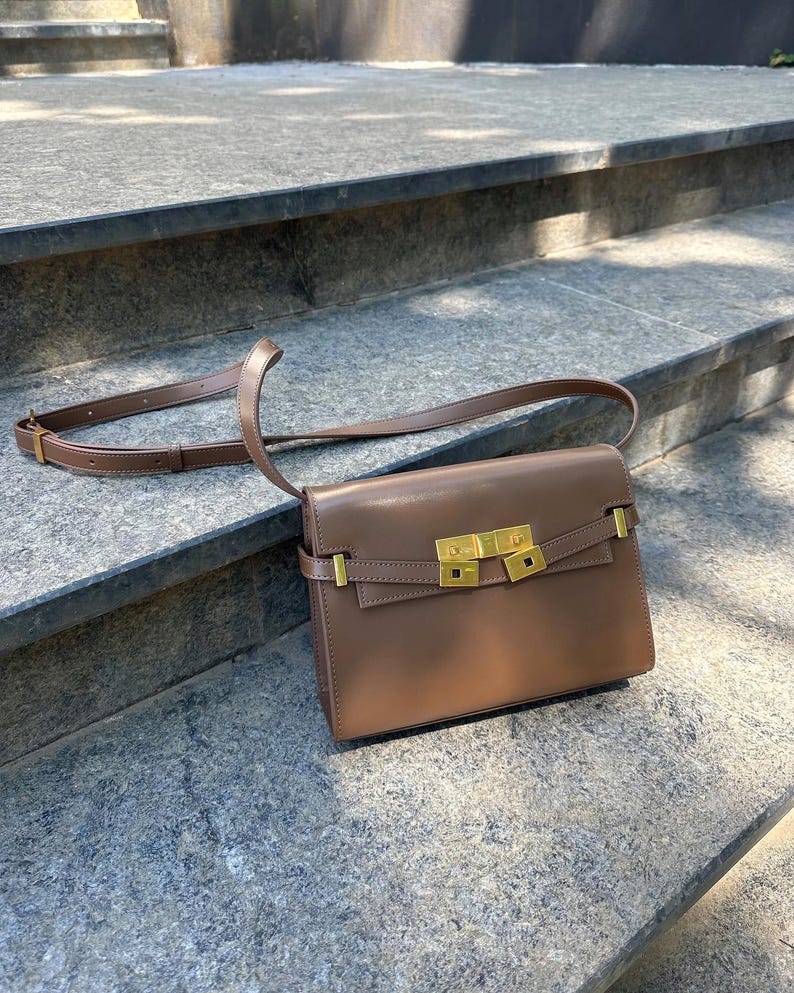 Handmade leather shoulder bag in brown with a relaxed shape for everyday use