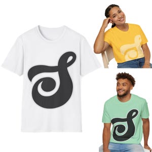May include: Three t-shirts featuring a stylized black and white graphic of a letter 'S' on a white, yellow, and green background.