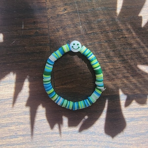 Green Metallic Smiley Face Clay Bead Bracelet Random Order