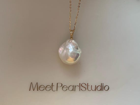 Metallic orient fire ball baroque pearl necklace. Premium quality large baroque necklace.