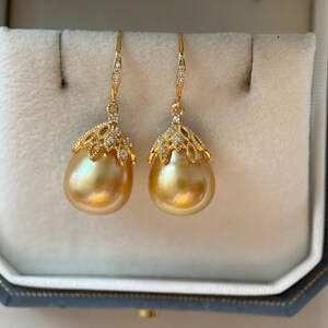 Large size natural color south sea golden pearl earrings. S925 sterling silver hook earrings.