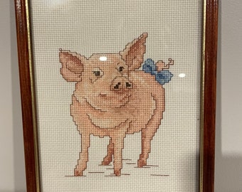 Framed cross stitch pig