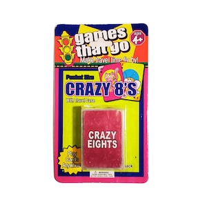May include: A pink and yellow card game packaging with the title "Pocket Size Crazy 8's" and a travel case. The packaging features a traffic light and the text "games that go".