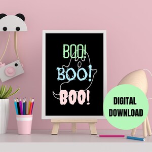May include: A printable digital download of a black and white illustration of a ghost with the text "BOO! BOO! BOO!" in green, blue, and pink.