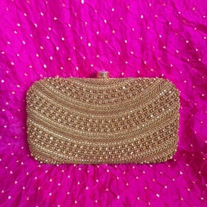 ALMOST SOLD OUT- Gold Indian Cluch with enclosed chain. The most classic purse for any outfit. Beautiful work.
