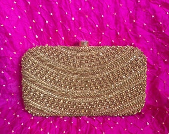 ALMOST SOLD OUT- Gold Indian Cluch with enclosed chain. The most classic purse for any outfit. Beautiful work.