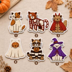 May include: Six embroidered cat patches featuring Halloween themes. Patch 1 is a Frankenstein cat, 2 is a skeleton cat, 3 is a devil cat in a red cape, 4 is a ghost cat, 5 is a raccoon cat with a pumpkin bucket, and 6 is a witch cat in a purple cape.
