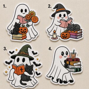 May include: Four embroidered patches featuring white ghosts. Patch 1 shows a ghost with flowers, a black cat, and a pumpkin. Patch 2 shows a ghost in a witch hat with a book, cat, and pumpkin. Patch 3 shows a ghost with a book and cat. Patch 4 shows a ghost with books and a drink.