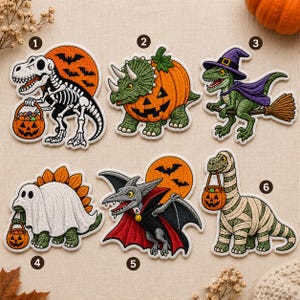 May include: Six embroidered iron-on patches featuring dinosaurs in Halloween costumes. Designs include a skeleton T-Rex with a pumpkin bucket, a triceratops pumpkin, a raptor witch on a broom, a ghost stegosaurus, a vampire pterodactyl, and a mummy long-neck.
