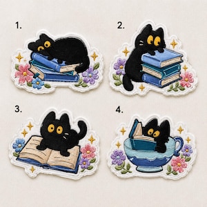 May include: Four embroidered patches featuring black cats with yellow eyes. Patch 1 shows a cat on blue books. Patch 2 shows a cat on a stack of blue books. Patch 3 shows a cat on an open book. Patch 4 shows a cat inside a blue teacup reading a book.