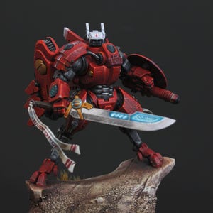 Commander Farsight Warhammer 40k miniature, professionally hand painted in Farsight Enclaves red and white. T'au Empire battlesuit commander, Elite tier display-quality commission painting, fully built, based and varnished.