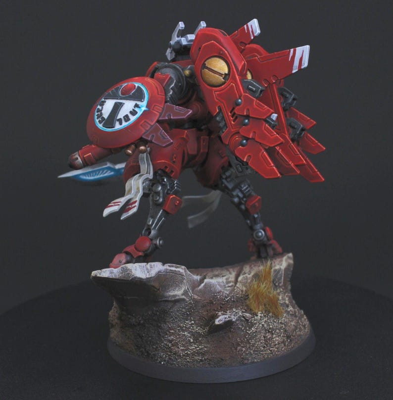 Commander Farsight Warhammer 40k miniature, professionally hand painted in Farsight Enclaves red and white. T'au Empire battlesuit commander, Elite tier display-quality commission painting, fully built, based and varnished.
