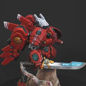 Commander Farsight Warhammer 40k miniature, professionally hand painted in Farsight Enclaves red and white. T'au Empire battlesuit commander, Elite tier display-quality commission painting, fully built, based and varnished.