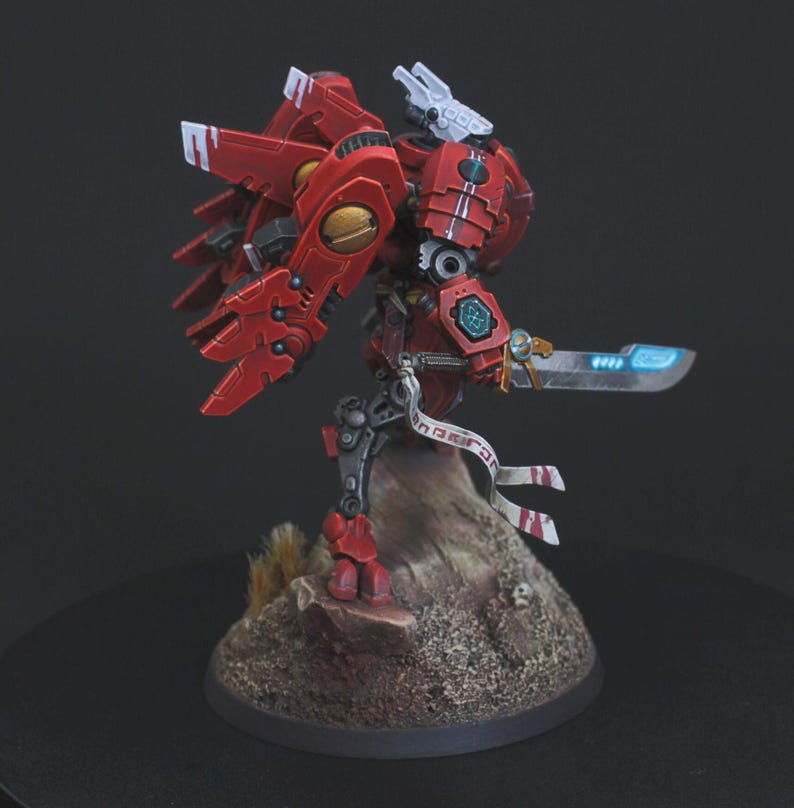 Commander Farsight Warhammer 40k miniature, professionally hand painted in Farsight Enclaves red and white. T'au Empire battlesuit commander, Elite tier display-quality commission painting, fully built, based and varnished.