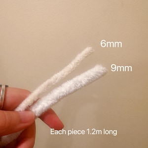 May include: Two white pipe cleaners, one 6mm in diameter and the other 9mm in diameter. Each pipe cleaner is 1.2m long.