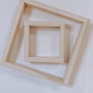 May include: Two unfinished wooden canvas frames, one square and one diamond-shaped, are displayed against a white background. The frames are made of light-colored wood and have small holes along the edges for securing canvas.