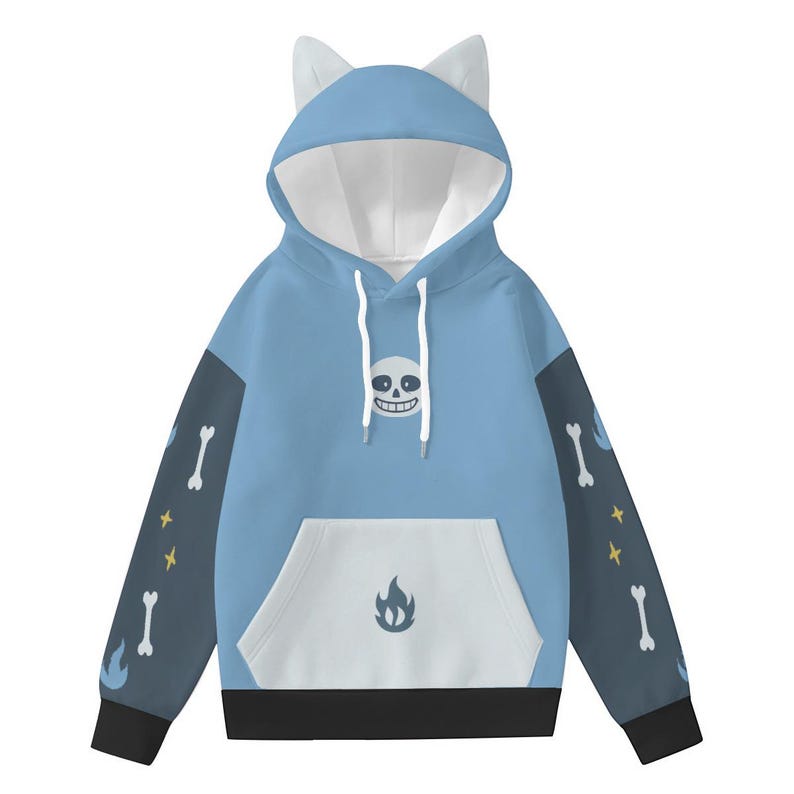 May include: A light blue hoodie with a white interior and cat ears. The front features a smiling skull graphic and a white pocket with a flame design. The sleeves are dark blue with bone and star patterns. The bottom hem and cuffs are black.