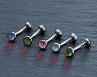 May include: Five silver barbell body jewelry pieces with different colored opal-like stones. The stones are in the colors blue, green, pink, white, and rainbow.