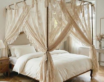May include: A four-poster bed with cream-colored lace curtains and bedding. The bed frame is a dark brown color, and the curtains are tied back with matching fabric. The room has a warm, inviting atmosphere with a wooden floor.