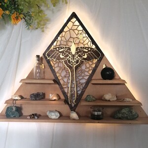 Luna Moth crystal shelf featuring a stunning golden moth perched on top, perfect for showcasing your crystals or small decorative objects. Ideal for use as an altar or a crystal display.