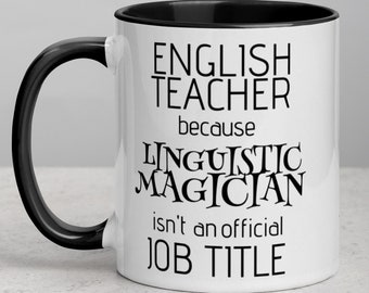May include: White ceramic coffee mug with a black rim and handle. The mug has black text that reads "English Teacher because Linguistic Magician isn't an official job title."