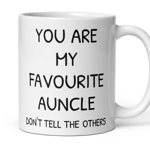 Può includere: Tazza in ceramica bianca con testo nero che recita "You are my favourite auncle Don't tell the others."