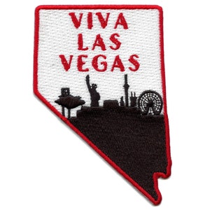 Peut inclure: Patch brodé rouge en forme de l'état du Nevada avec le texte "Viva Las Vegas" en rouge et une silhouette noire de l'horizon de Las Vegas.