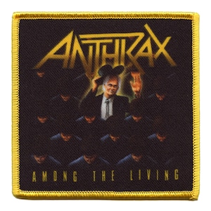 May include: A black and gold embroidered patch with the band name "Anthrax" and the album title "Among The Living" in white text.