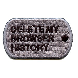 May include: A gray military-style dog tag with black embroidered text that reads "DELETE MY BROWSER HISTORY".