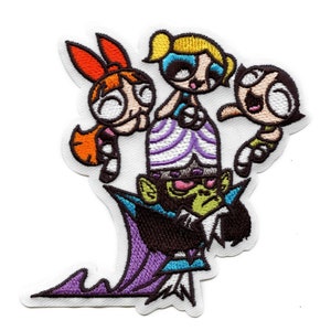 May include: An embroidered patch featuring the Powerpuff Girls, Blossom, Bubbles, and Buttercup, standing on top of the villain Mojo Jojo. The patch is white with colourful embroidery.