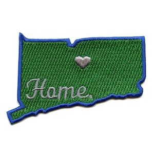 May include: Green embroidered patch shaped like the state of Connecticut with a blue outline. The word "Home" is embroidered in white on the patch, with a small white heart above it.