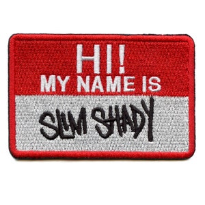 May include: Red and white name tag with the text "HI! MY NAME IS SLIM SHADY" in black lettering.
