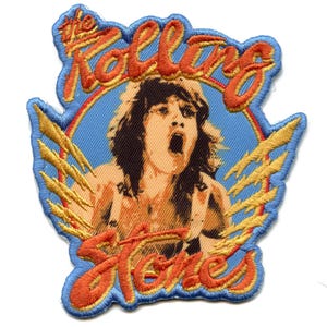 May include: A vintage-style embroidered patch featuring a portrait of Mick Jagger, the lead singer of The Rolling Stones, with the band's name in a stylised font. The patch is surrounded by lightning bolts and has a blue background.