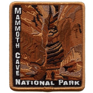May include: Embroidered patch featuring a brown and tan image of Mammoth Cave National Park. The text "MAMMOTH CAVE NATIONAL PARK" is embroidered in white on a black background.