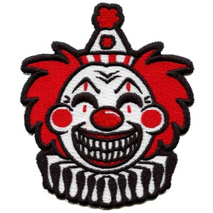 May include: Embroidered patch of a clown's face with a wide, toothy grin. The clown has red hair, a red nose, and a black and white striped collar.