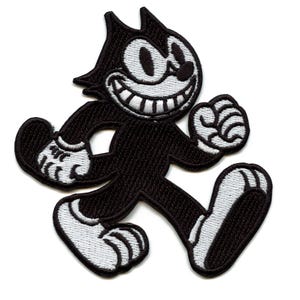 May include: Black and white embroidered iron-on patch of a cartoon cat walking with a mischievous grin.