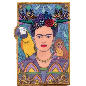 May include: An embroidered patch featuring a colorful portrait of Frida Kahlo with a flower crown, a parrot, and a monkey. The background is a vibrant blue and green floral pattern.