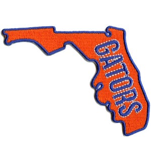 May include: Orange and blue embroidered patch shaped like the state of Florida with the word "GATORS" in blue lettering.