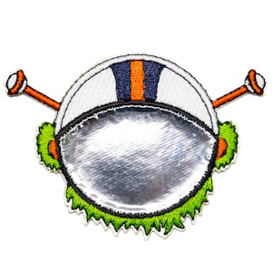 May include: An embroidered patch of a cartoon alien head with a white helmet with orange and blue stripes, green hair, and two orange antennas. The alien's face is a silver circle.