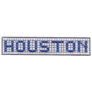 May include: White embroidered patch with the word "HOUSTON" in blue lettering.