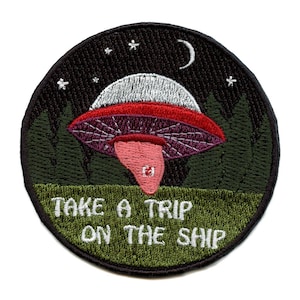 May include: Embroidered patch with a cartoon UFO flying over a forest at night. The text "Take a trip on the ship" is written below the UFO.