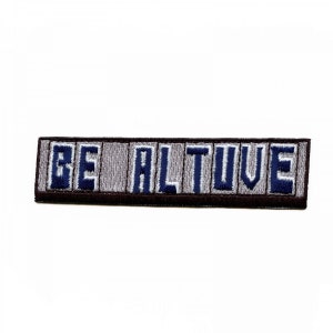 May include: A grey and blue embroidered patch with the text "BE ALTIVE" on a brown background.