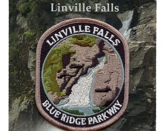 May include: Embroidered patch with a brown background and a white and blue image of Linville Falls. The text "Linville Falls" and "Blue Ridge Parkway" are embroidered in brown on the patch.