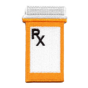 May include: Orange and white embroidered patch of a prescription bottle with the letter "Rx" on the label.