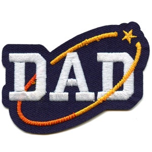 May include: White embroidered patch with the word "DAD" in a navy blue oval with a yellow and orange orbit around it and a yellow star.