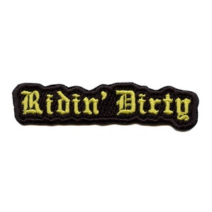 May include: Black embroidered patch with the text "Ridin' Dirty" in yellow.